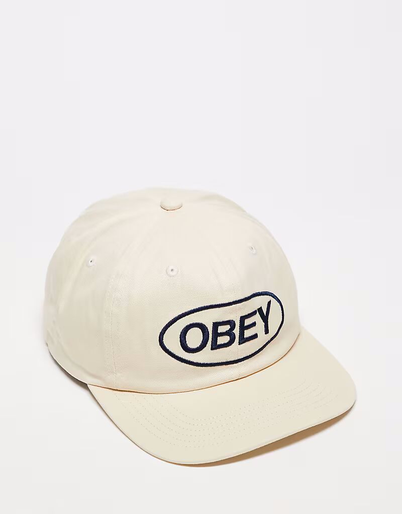 Obey - кепка с ремешком сзади, кремового цвета, с 6-панельным дизайном и овальным логотипом «Obey»
Obey - кепка с ремешком сзади, кремового цвета, с 6-панельным дизайном и овальным логотипом «Obey»