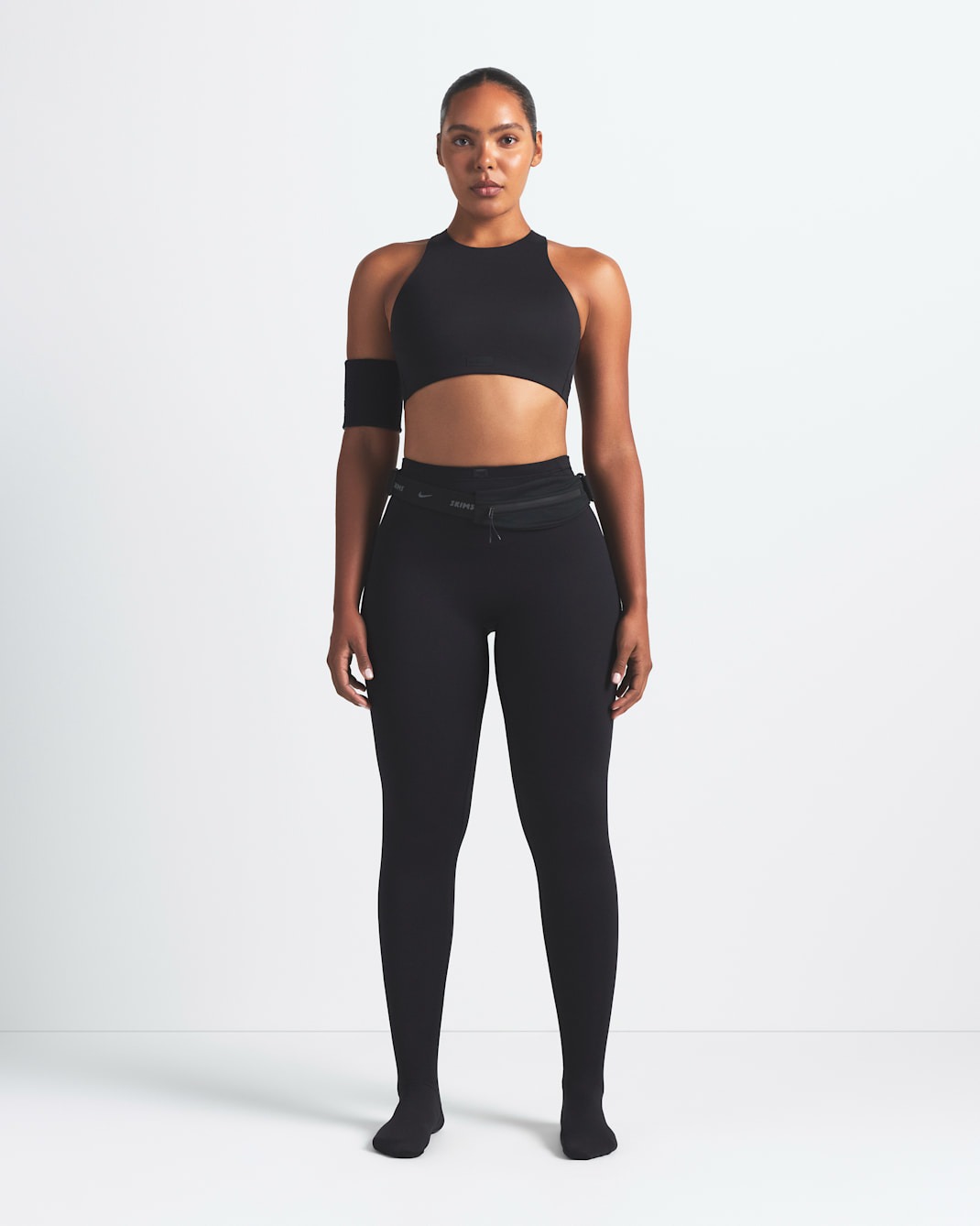 Леггинсы NikeSKIMS Matte Women's High-Waisted Footsie Grip, черный — фото 2