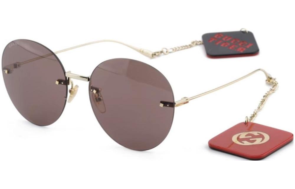 

GUCCI Солнцезащитные очки с круглой оправой и кулоном с логотипом