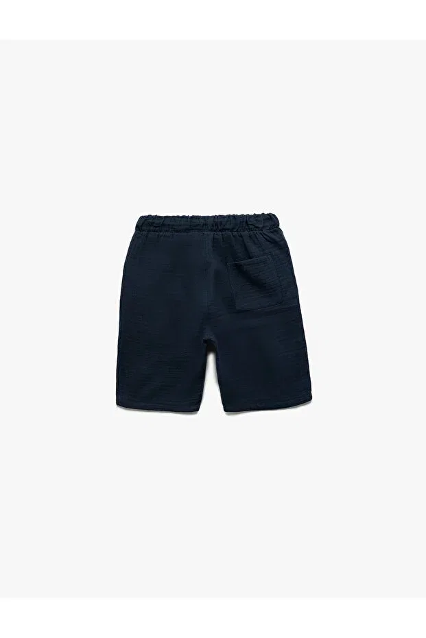 Детские шорты для мальчиков хлопковые Basic shorts with cotton waist lace pocket detail Koton, Navy Blue — фото 4