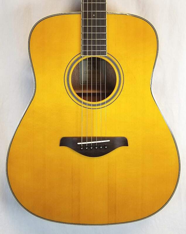 

Гитара Yamaha FG-TA TransAcoustic Dreadnaught; Верхняя дека из массива ели, красное дерево B/S, винтажный оттенок FG-TA VT
