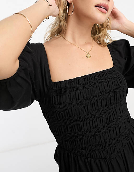 

Черный комбинезон с льняным лифом и пышными рукавами ASOS DESIGN