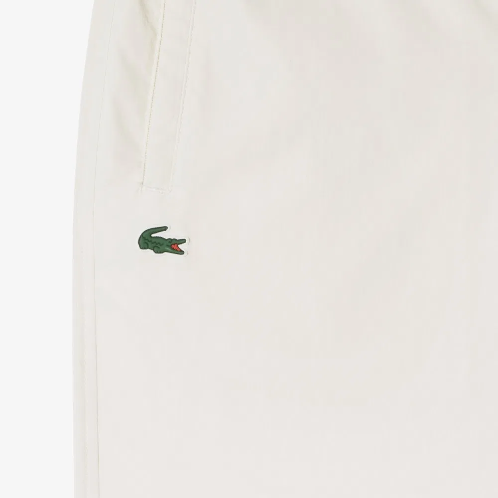 Брюки женские Lacoste зауженные, эластичный материал, айвори — фото 2