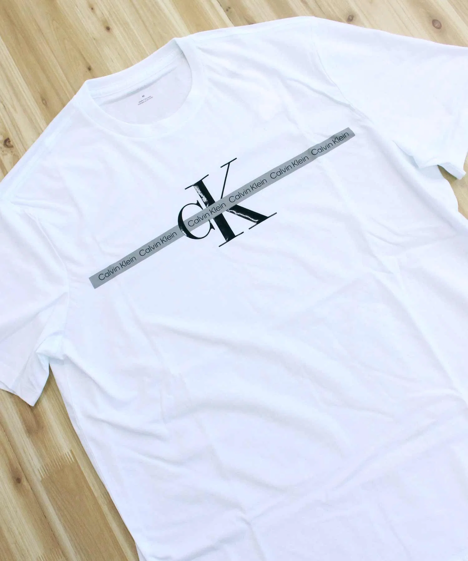 Мужская и женская футболка Calvin Klein Jeans CKJ TAPE REPEAT LAYERED LOGO CREW NECK TEE — фото 4