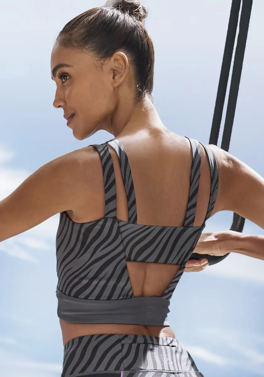 

Укороченный топ LASCANA ACTIVE "- спортивный топ, короткий топ ", с рисунком "зебра" и вырезами на спине, черный