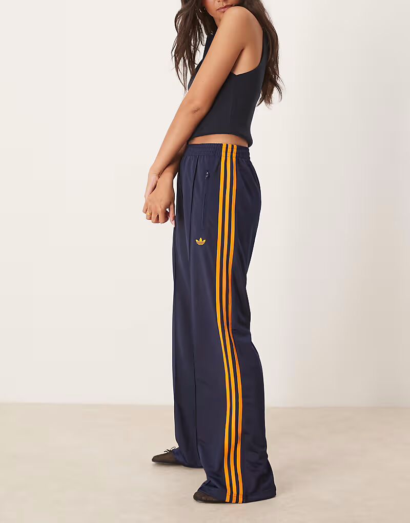 

Спортивные брюки Adidas Originals Firebird Loose темно-синего и оранжевого цветов