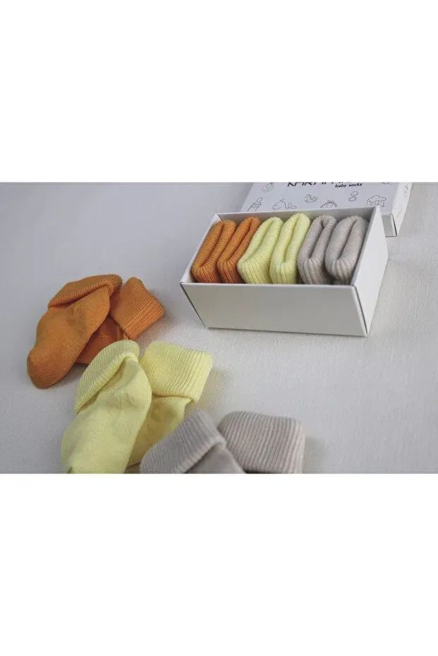 Детские носки для новорожденных с принтом 3-Piece baby socks Karamila, Yellow-Orange-Stone — фото 2