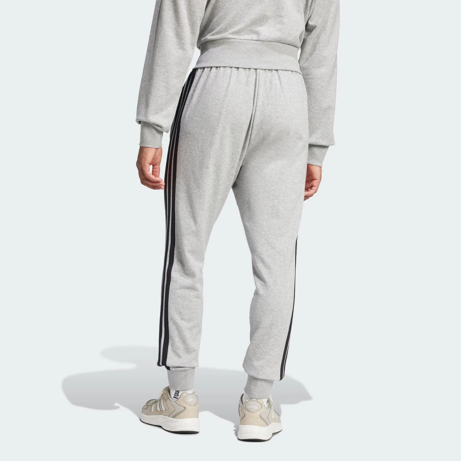 Женские спортивные брюки с зауженным кроем Essentials 3-Streifen French Terry Hose Adidas, Цвет: Grau Schwarz Grau — фото 3