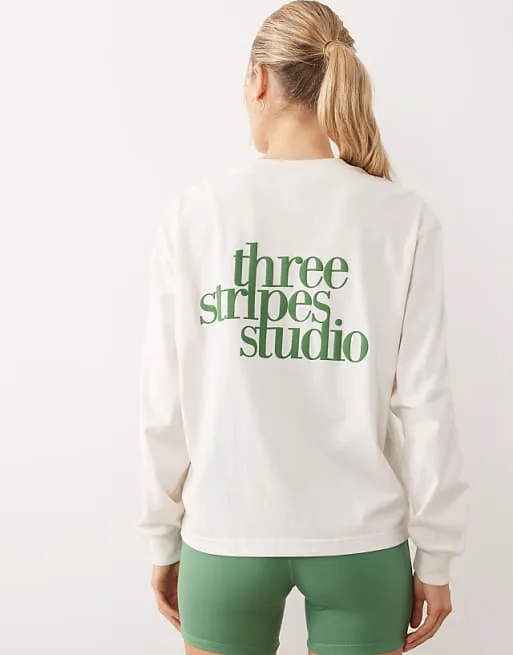 

Белый топ с длинными рукавами adidas Performance Three Stripes Studios