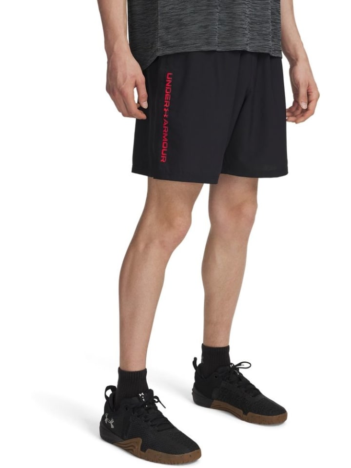 

Спортивные шорты Tech Woven Wordmark Shorts черного цвета Under Armour