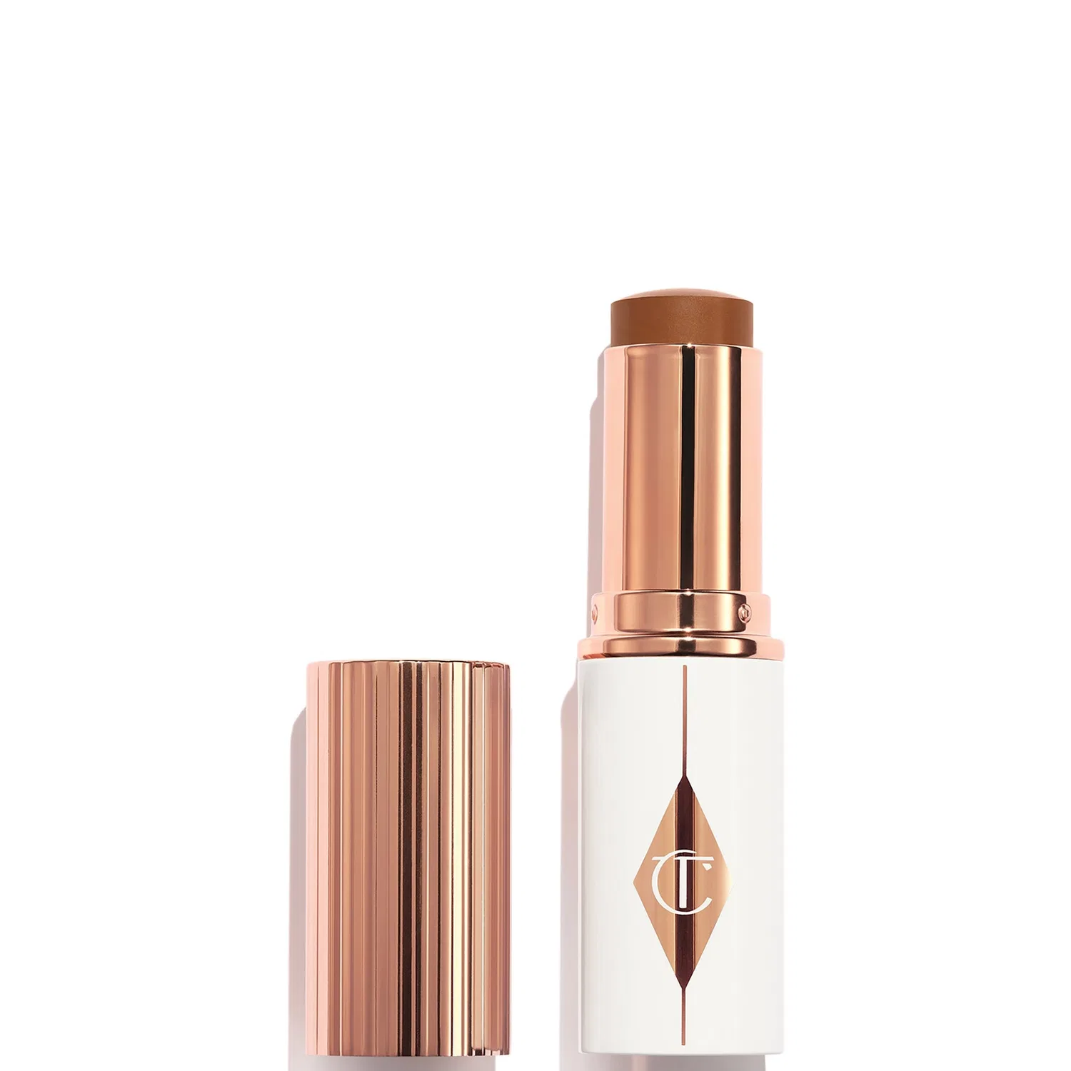 Тональный стик Unreal Skin Sheer Glow Tint Charlotte Tilbury, 10 г, Shade 14 Deep