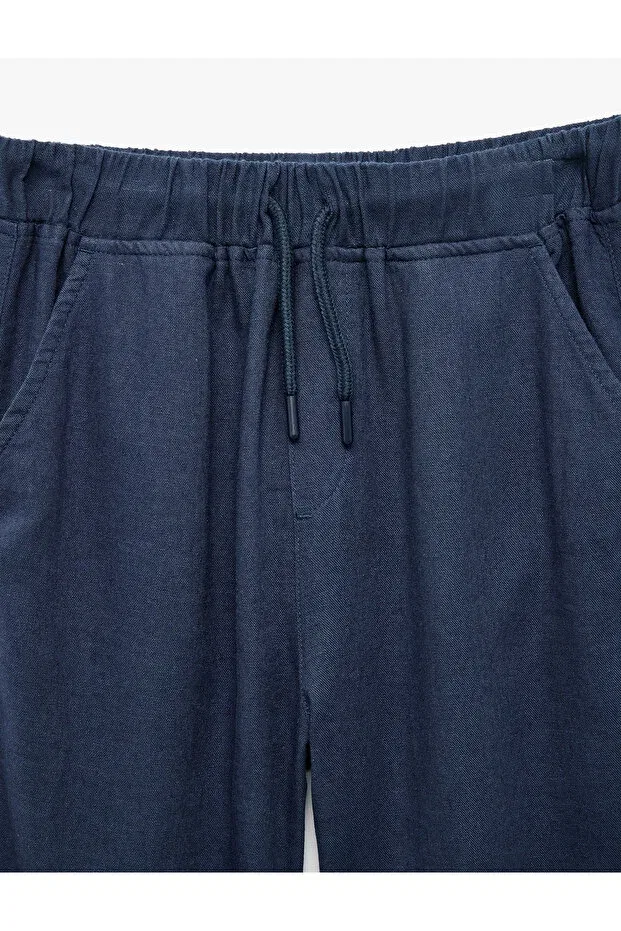 Детские брюки для девочек из льна с вискозой Linen and viscose blend basic trousers with tie waist Koton, Navy Blue — фото 4