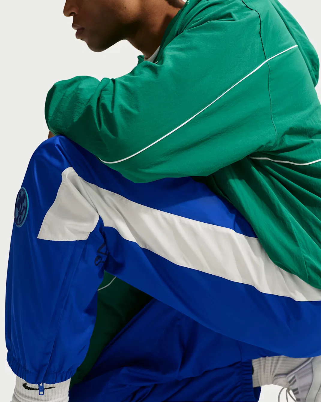 Мужские брюки Storm-FIT с графическим принтом Nike Windrunner, Old Royal/Summit White/Court Green — фото 4