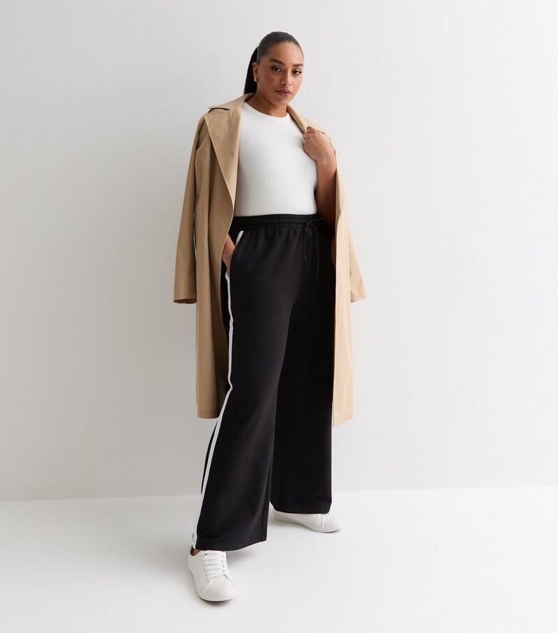 

Широкие джоггеры Curves с черными полосками по бокам New Look, черный