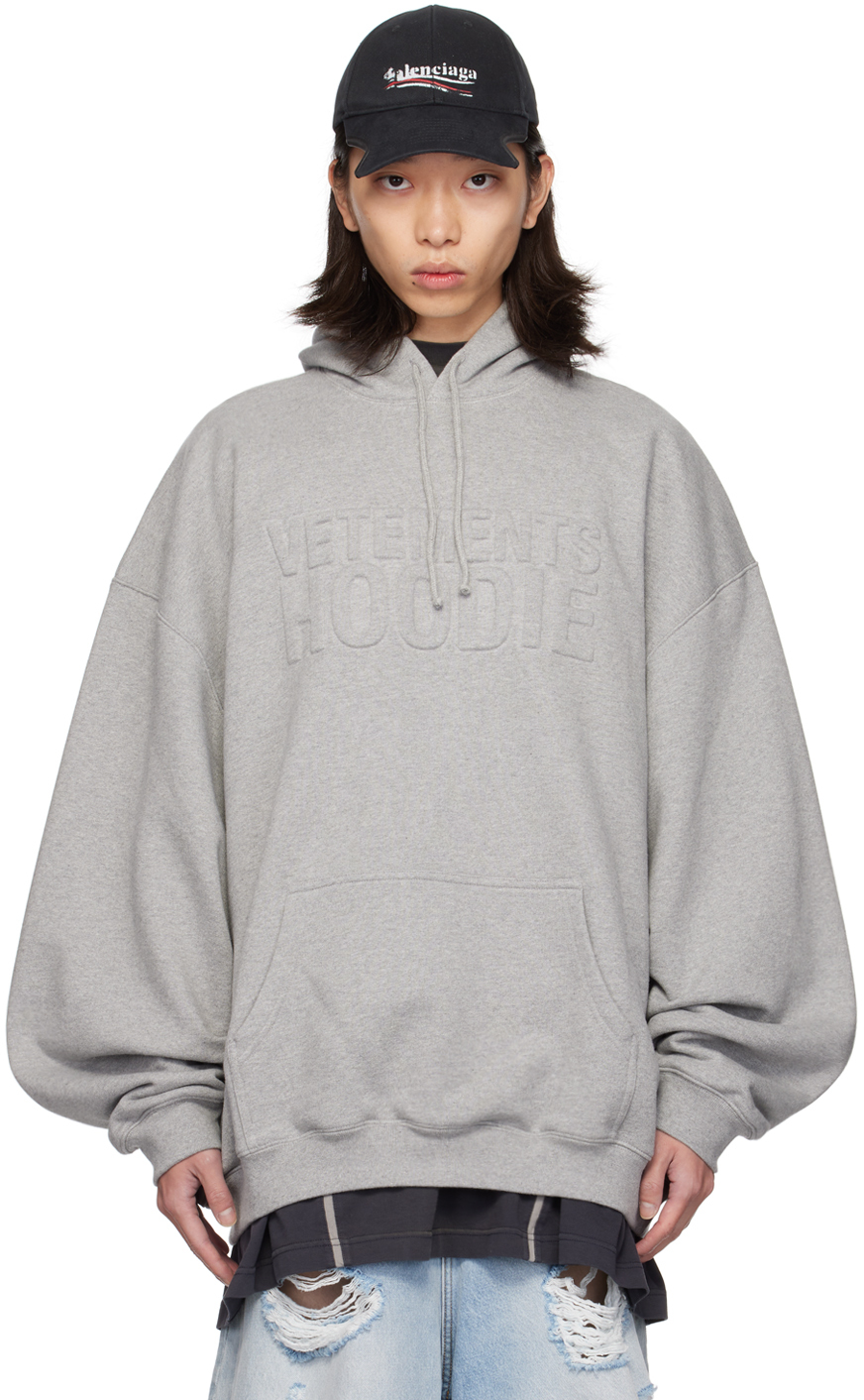 

Серая толстовка с капюшоном и логотипом Illusion VETEMENTS