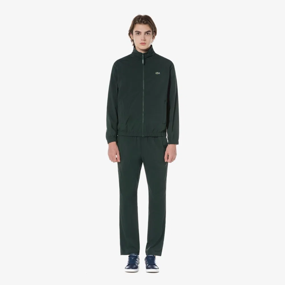 Мужские тканые базовые брюки глубокого зелёного цвета от Lacoste