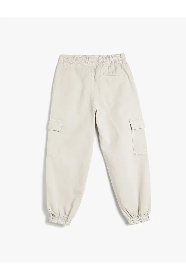 Детские спортивные брюки для мальчиков хлопковые Cotton jogger trousers with lace-up waist and flap pocket detail Koton, Stone — фото 4