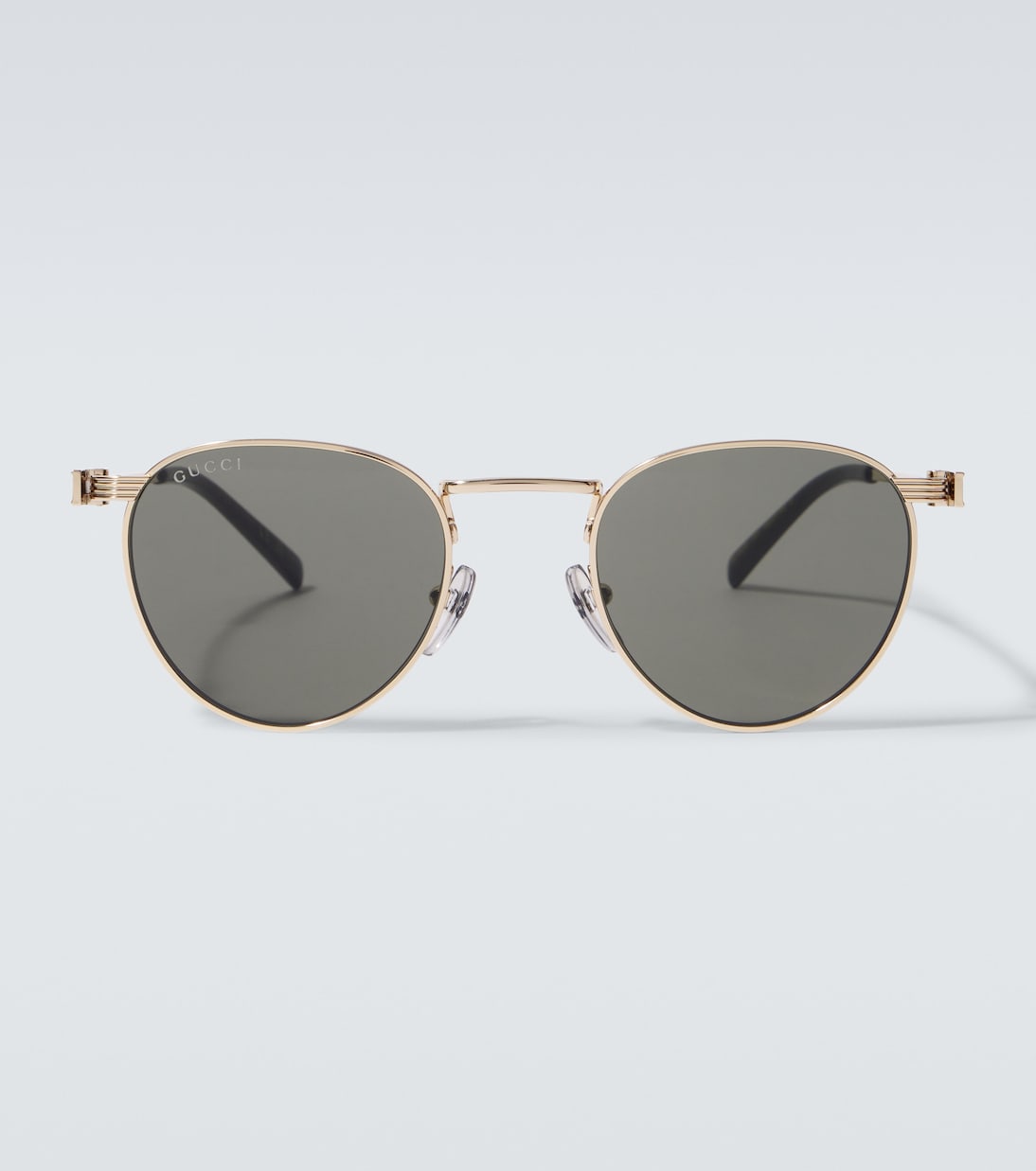 

Круглые солнцезащитные очки Gucci