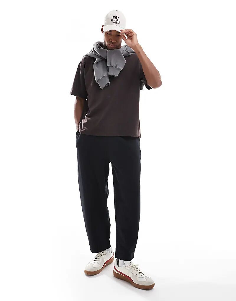 

Свободные зауженные спортивные брюки ASOS DESIGN черного цвета