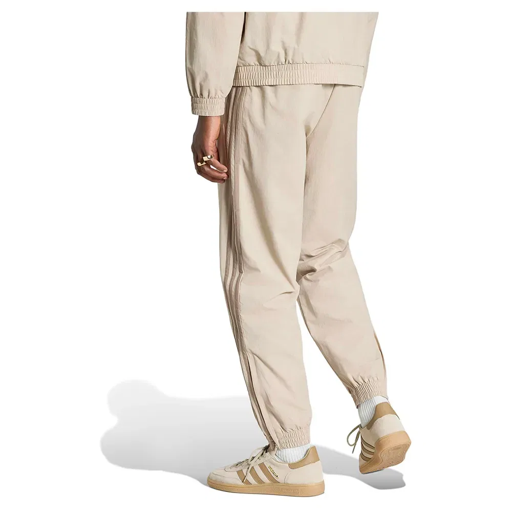 Мужские спортивные брюки из трикотажа Firebird Woven Track Adidas Originals, Beige — фото 2