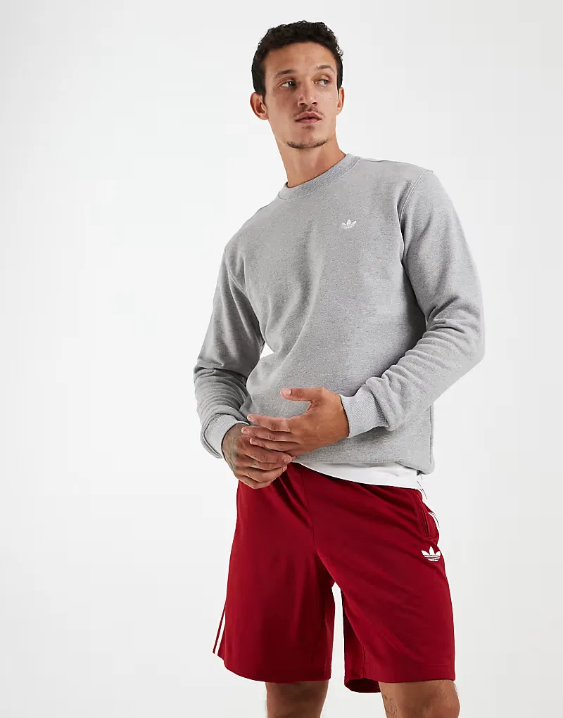 Шорты Adidas Originals Firebird в красно-белой расцветке, символизирующей победу команды