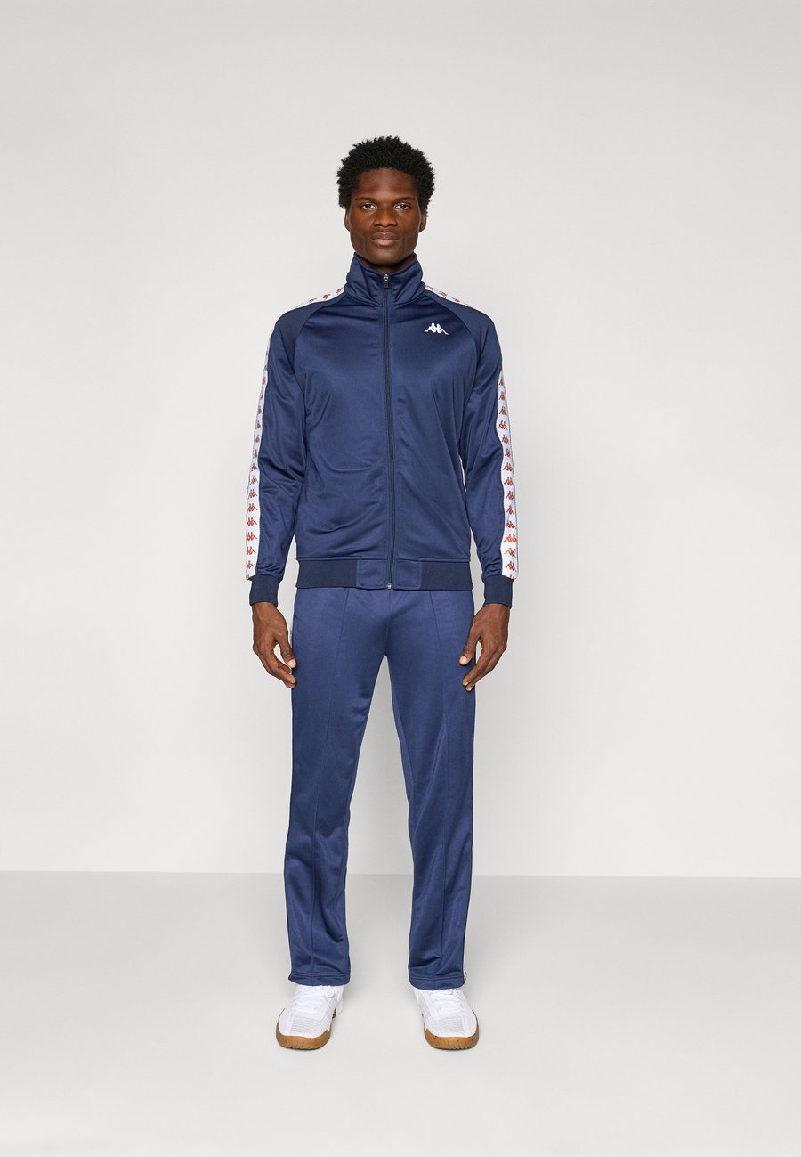 

Спортивный костюм Kappa Tracksuit, Blue Iris/White/Brown Honey/Blue