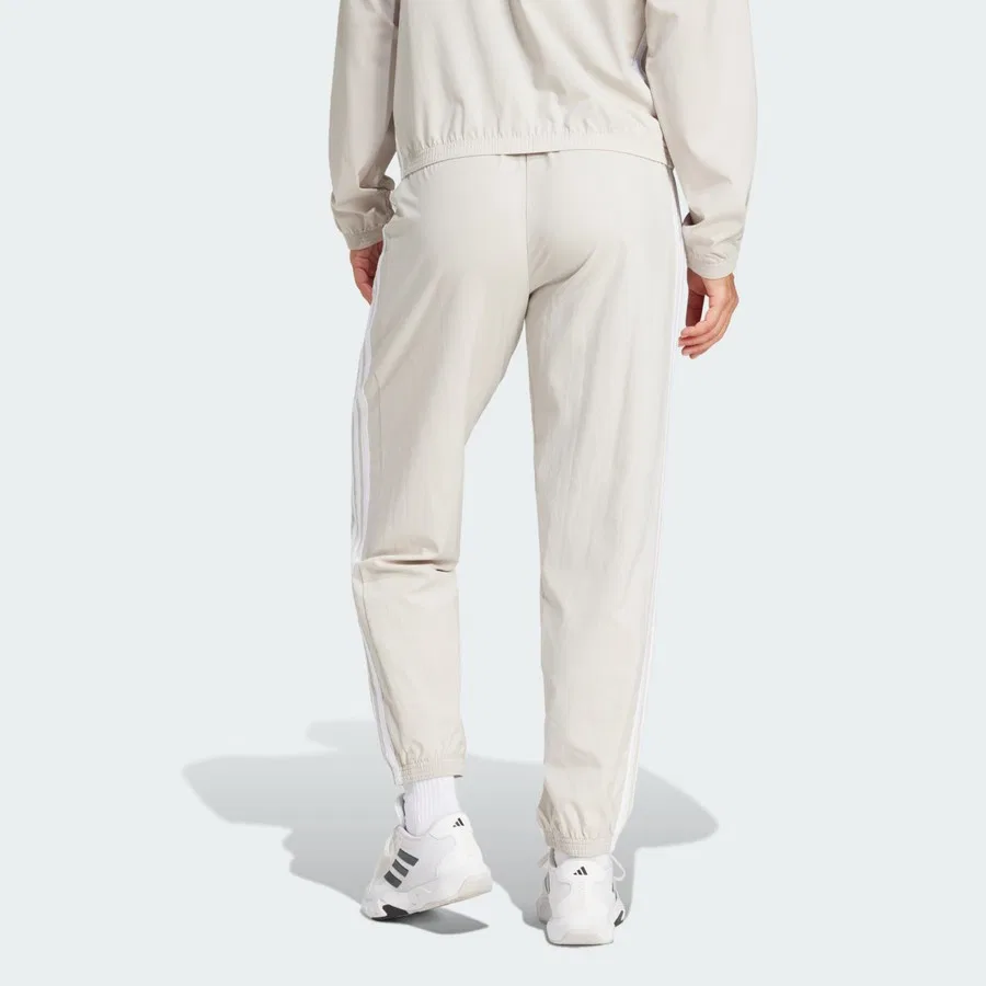 Спортивные штаны с зауженными штанинами Train Essentials 3-Stripes Woven Pants adidas, Бежево-белый — фото 2