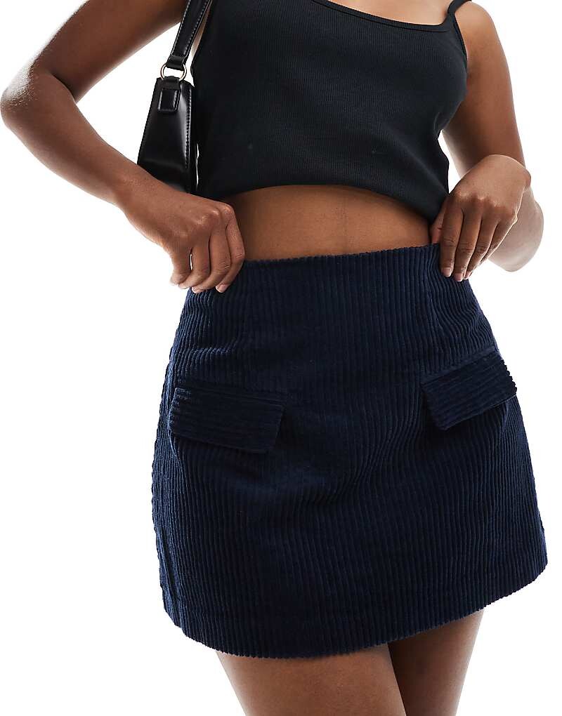 

ASOS DESIGN – темно-синяя вельветовая юбка с декоративными карманами