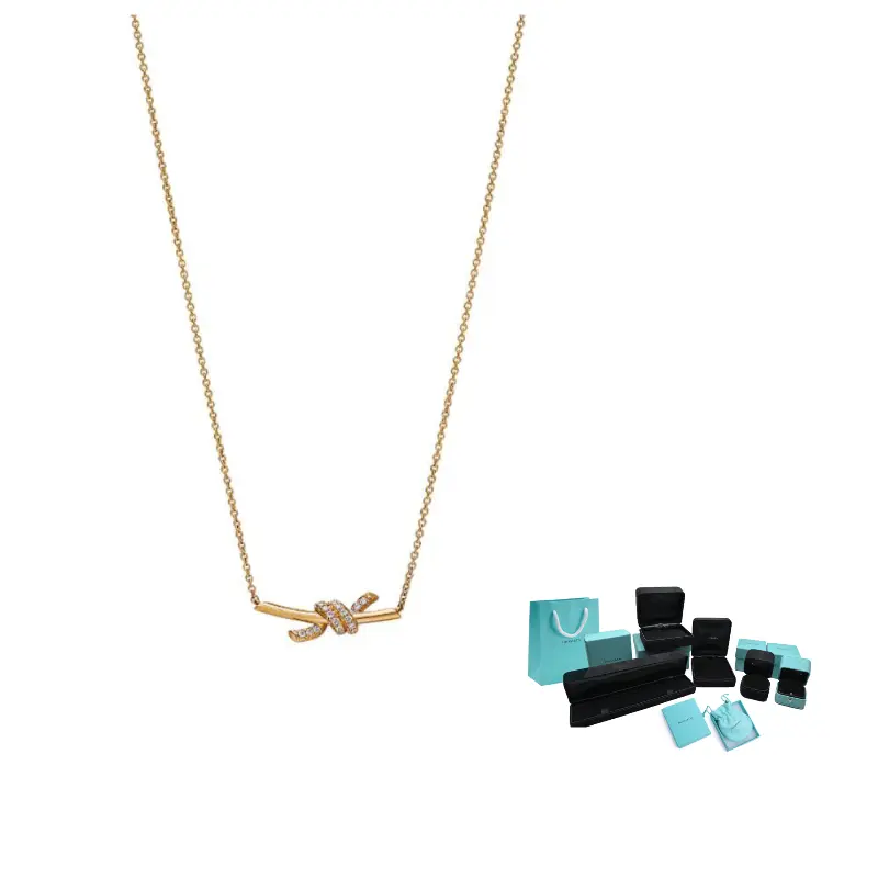 

Золотые колье Knot Collection из 18-каратного золота для женщин Tiffany & Co., золото