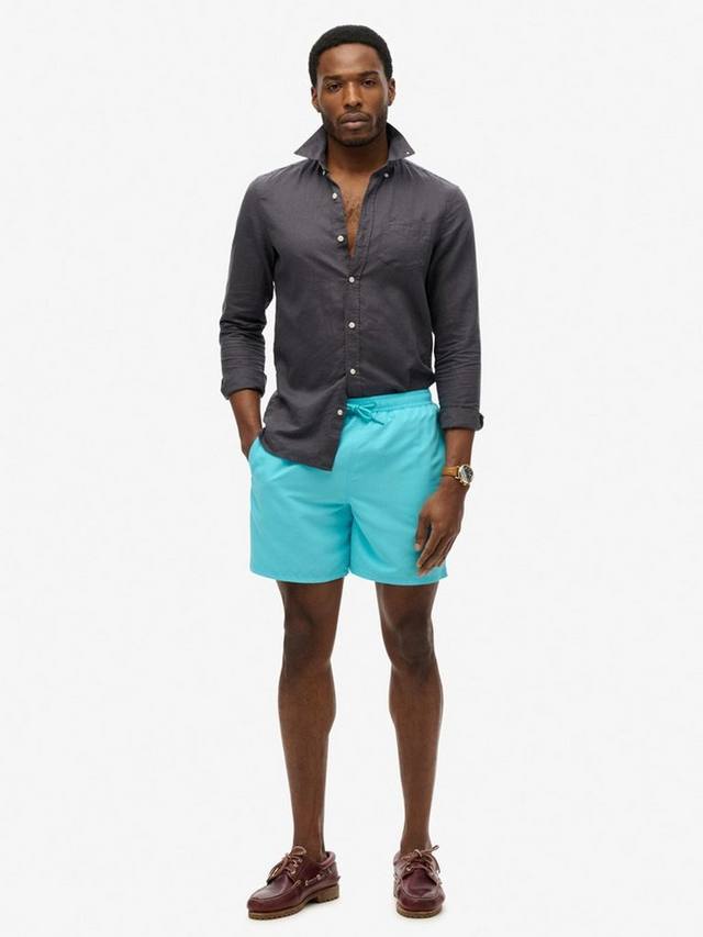 

Незаменимые 17-дюймовые плавательные шорты Superdry, цвет Aquamarine Blue