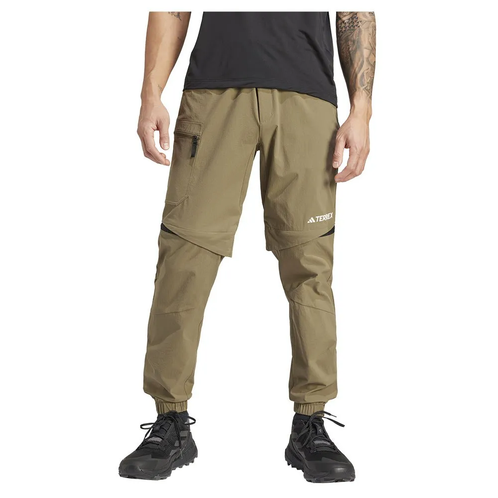 

Брюки adidas Utilitas Z.O, коричневый