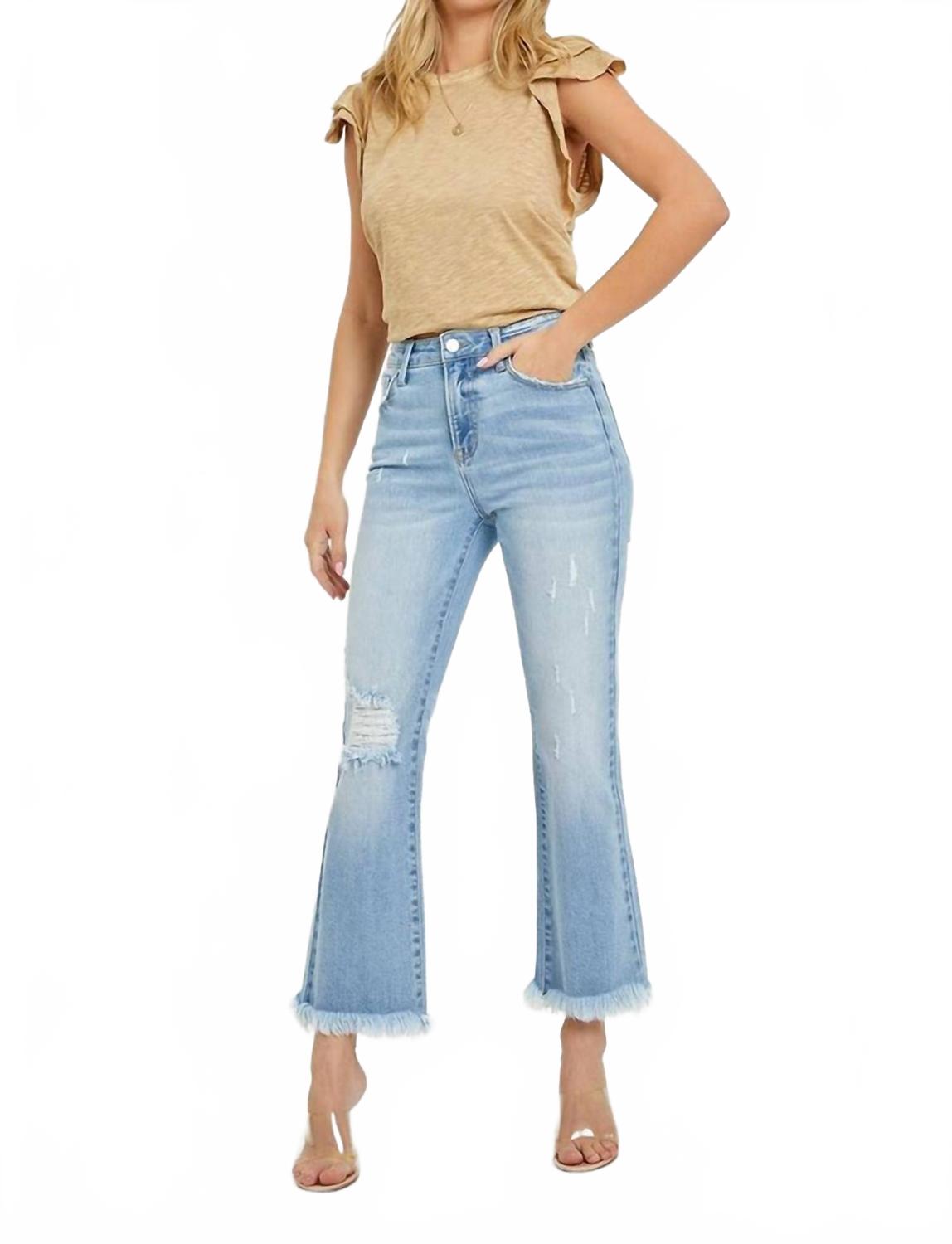 

Синие укороченные джинсы-клеш с высокой посадкой и рваным краем RISEN