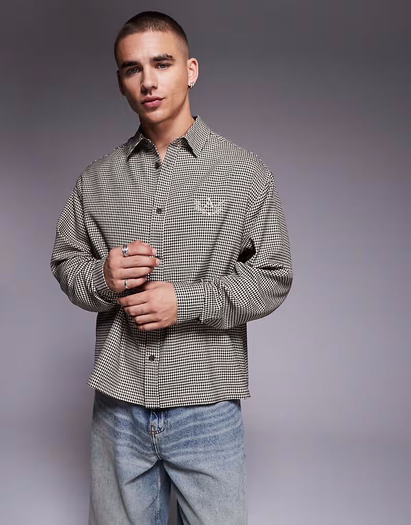

Рубашка свободного кроя в клетку ASOS DESIGN черного цвета с вышивкой на груди