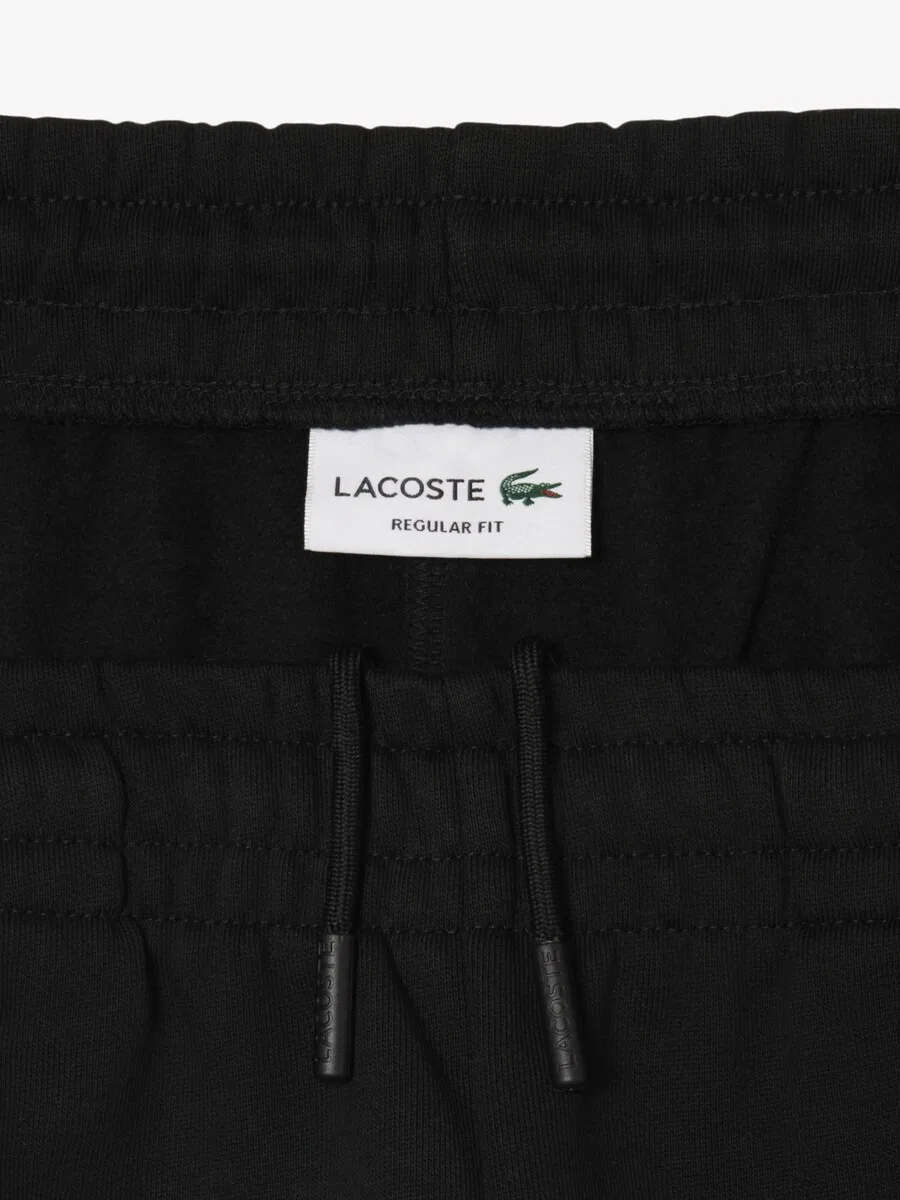 Зауженные брюки LACOSTE черного цвета — фото 3