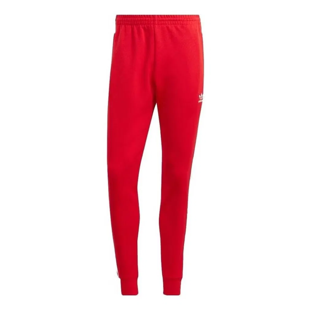 Брюки спортивные с лампасами Adicolor Classics SST Adidas, красный