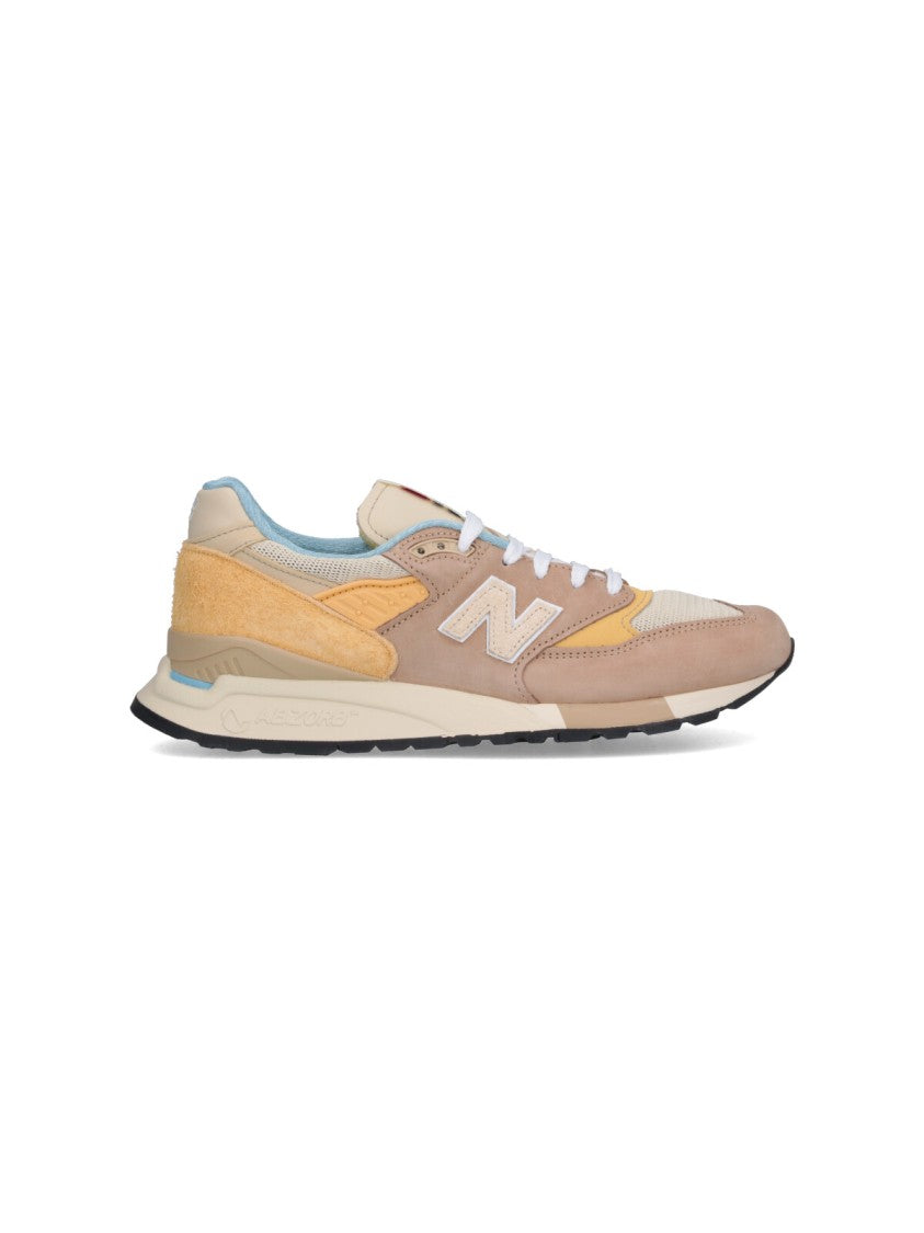 

Замшевые кроссовки с сетчатыми вставками и фирменным логотипом New Balance, мультиколор