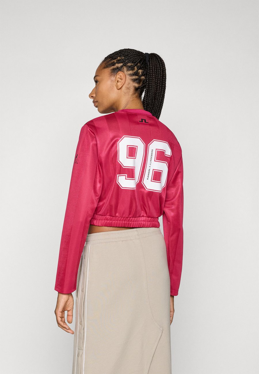 

Топ J.LINDEBERG Sports FIONA KANGOL FOOTBALL, Vivacious/Bordeaux