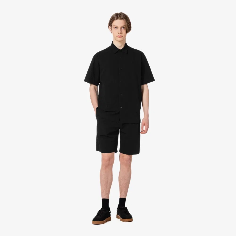 Мужские тканые шорты-бермуды чёрного цвета от Lacoste