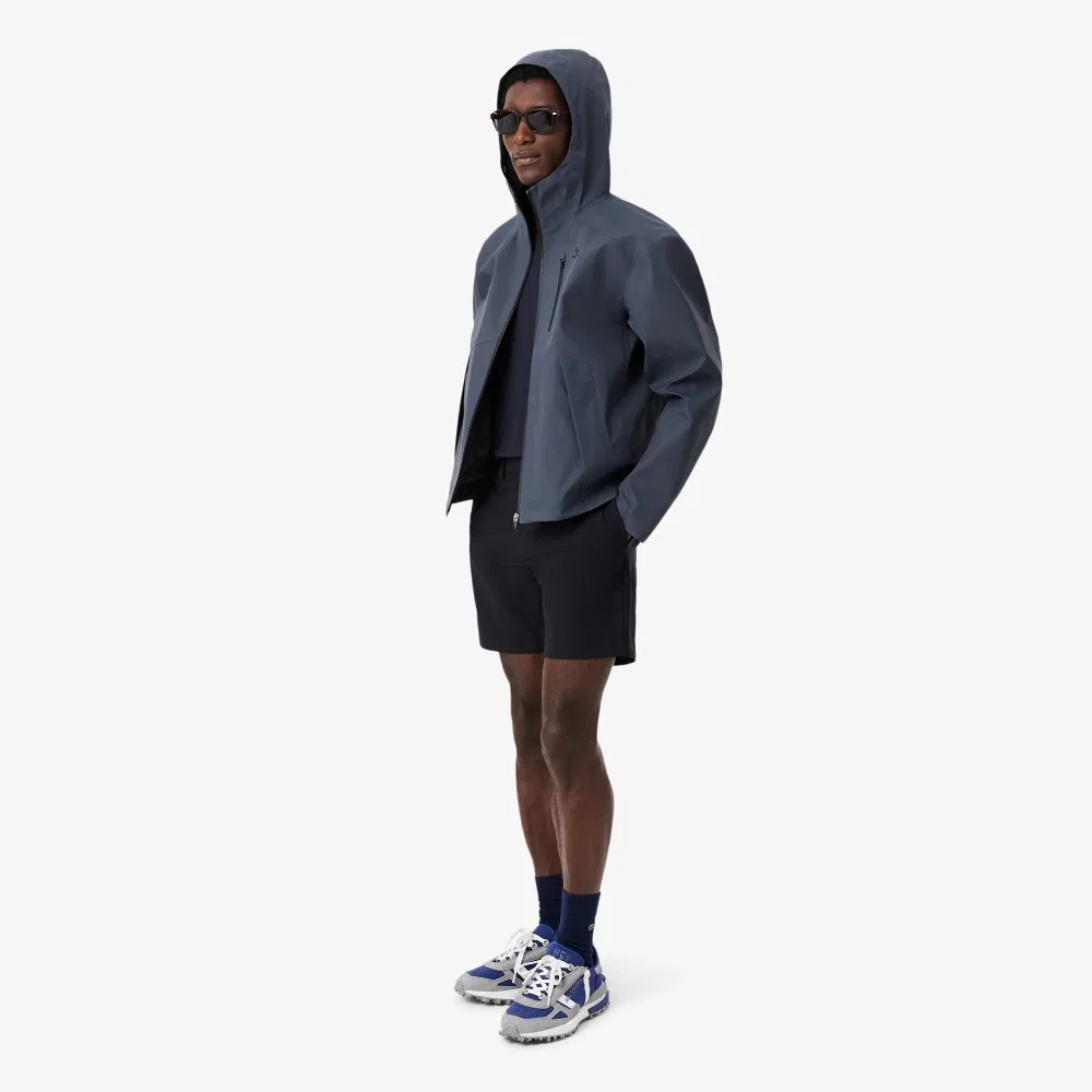 Мужские эластичные шорты-бермуды из полиэстера тёмно-синие от Lacoste — фото 4