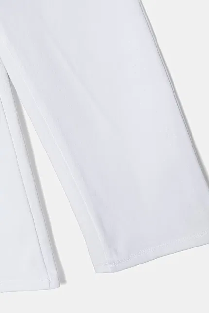 Спортивные штаны из мягкого хлопка модель Spodnie dresowe dziecięce United Colors of Benetton, белый — фото 3