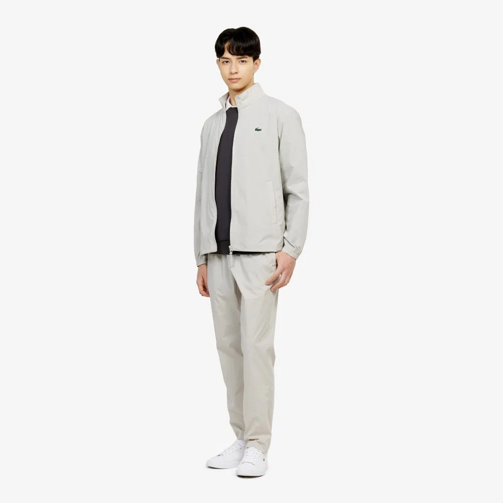Мужской эластичный тканый пиджак бежевого цвета от Lacoste — фото 4
