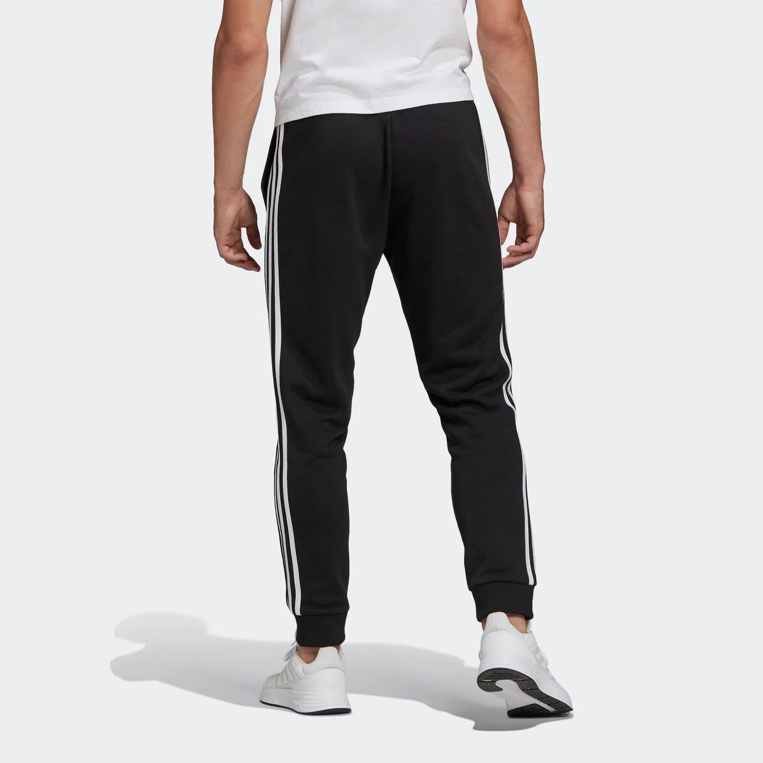 Мужские спортивные штаны из футера с манжетами Essentials French Terry Tapered Cuff 3-Streifen Adidas, Schwarz Weiss — фото 4