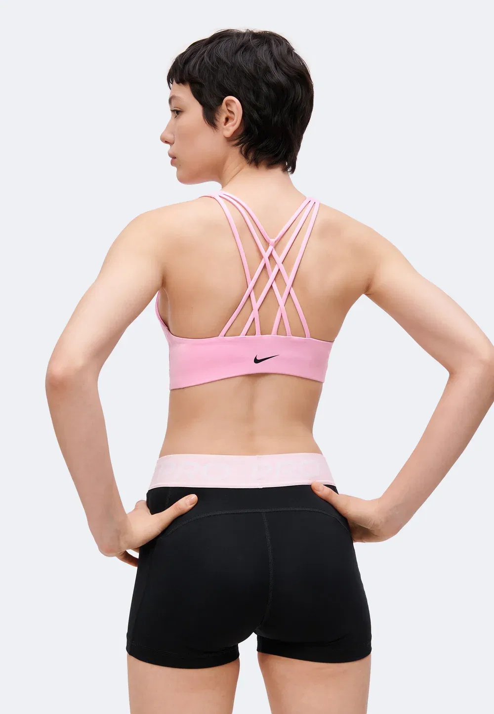 W nk df indy strappy bra - спортивный бюстгальтер со средней поддержкой Nike Performance, Pink Rise/Black — фото 4