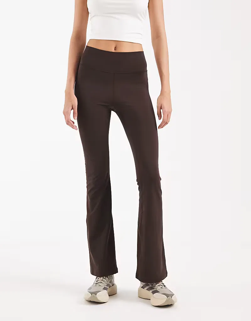 Леггинсы Adidas Performance All me essentials Flare в цвете Aurora Coffee