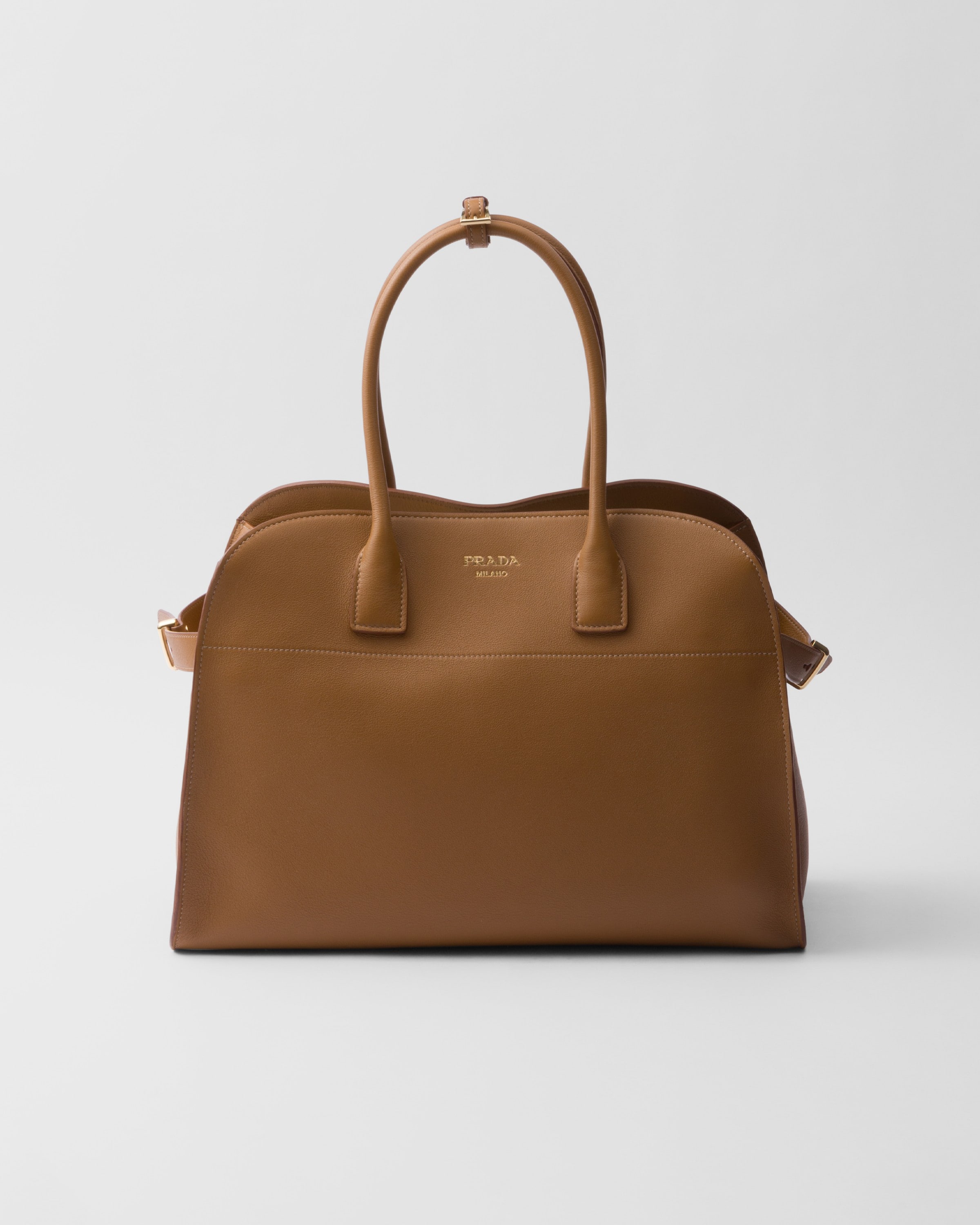 

Большая кожаная сумка-тоут с пряжками Prada, карамель