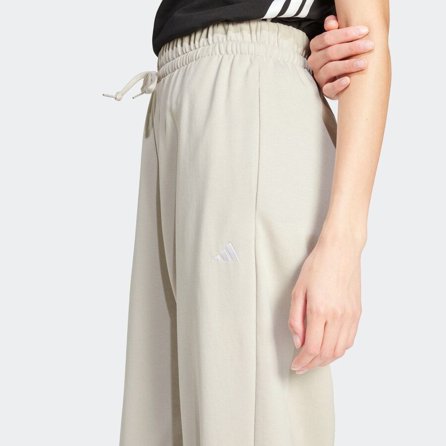 Зауженные тренировочные брюки ADIDAS SPORTSWEAR Essentials, кремовый — фото 4
