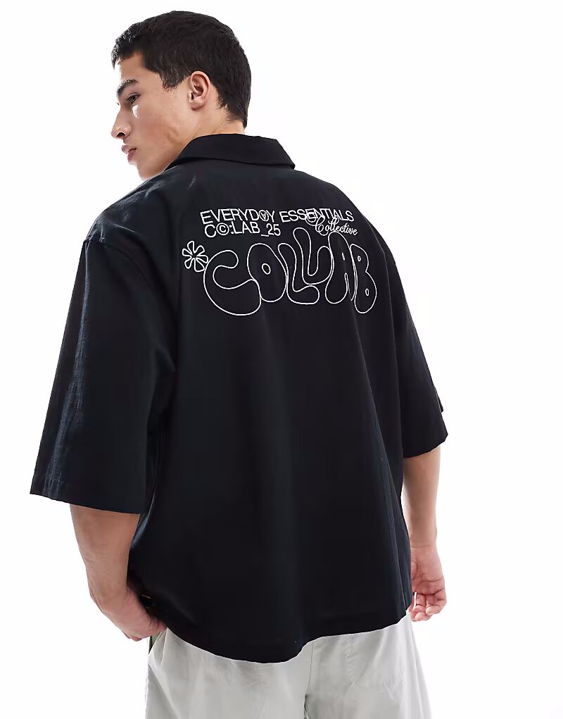 

Черная свободная рубашка ASOS DESIGN с принтом на спине