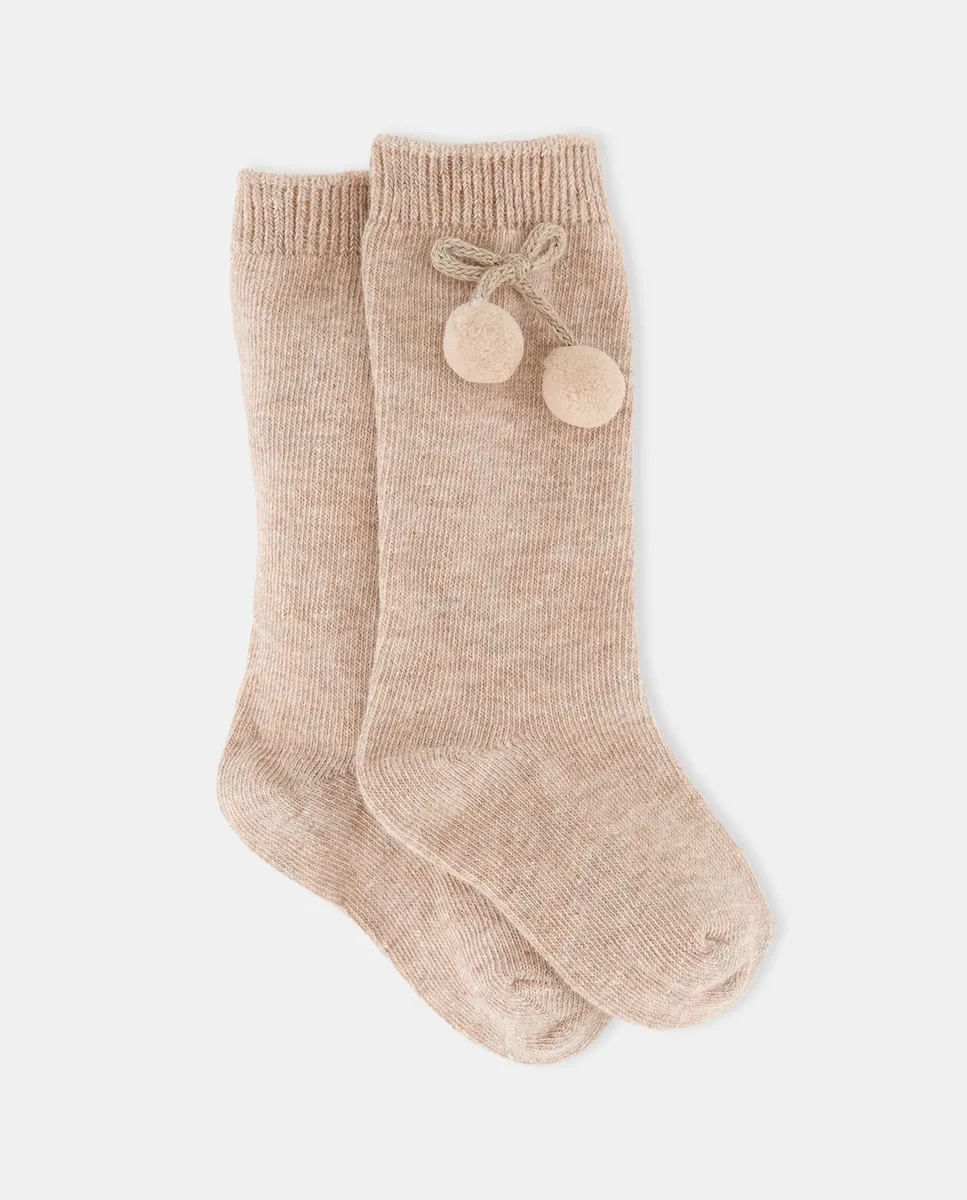 

Высокий носок для малышки с помпоном Cotton Juice, бежевый