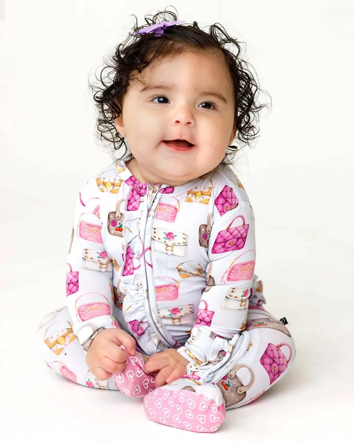 Детский боди-комбинезон с закрытыми ножками и оборками Jules Ruffled Zippered Footies Lev Baby, Pinks Purples And Golds