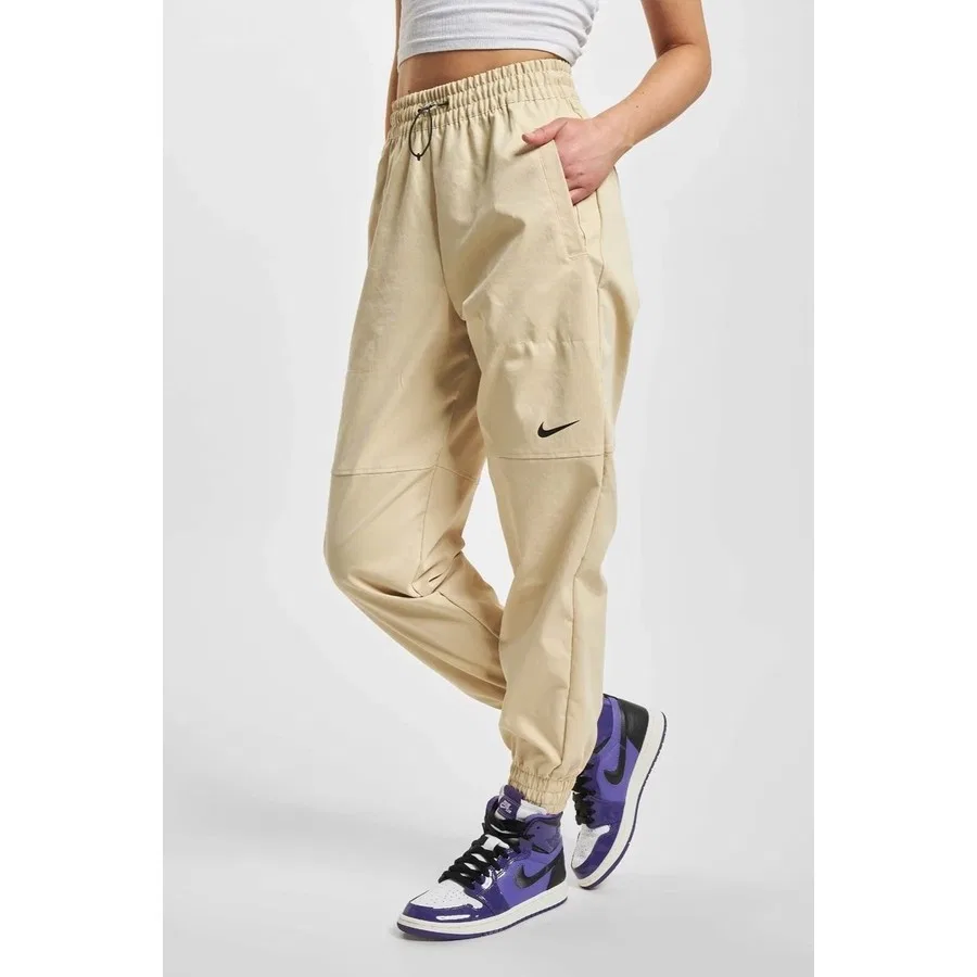 Женские спортивные штаны Nike Sportswear Swoosh Woven, свободный крой, с эластичными манжетами, Желтый — фото 2